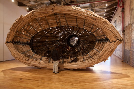 Nari Ward, Nu Colossus, 2011, boat, metal, wood, metal chimney, copper drum, furniture, plexiglas and rubber roofing membrane, 720 x 336 x 168 inches (approximately) 1828.8 x 853.4 x 426.7 cm. In collaboration with MassMoCA North Adams, MA. Courtesy the artist and Lehmann Maupin Gallery, New York