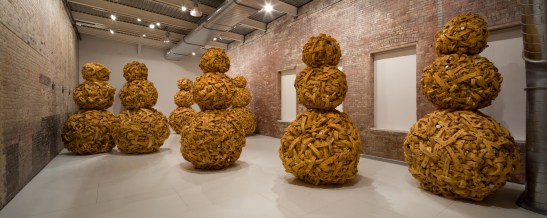 Nari Ward, Mango Tourist, 2011, foam, battery canisters, Sprague Electric Company resistors and capacitors, mango pits, 8 figures, each approximately 120 inches. Courtesy the artist and Lehmann Maupin Gallery, New York