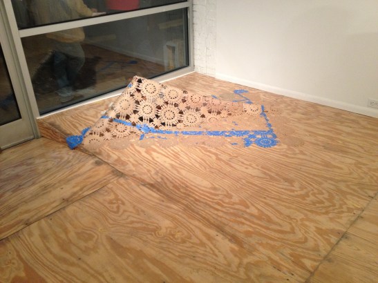 Kim Faler, Little Bird, 2010, hand-cut brown paper, painters tape, pheasant, 71" x 52"x 16". Installation view. Image courtesy of Erin Dziedzic